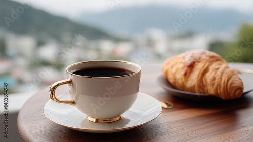 Obraz na płótnie Croissant and coffee on a wooden table with a scenic view of the city during a sunny morning w salonie