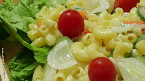 Macaroni salad with lots of tomatoes and other vegetables	
