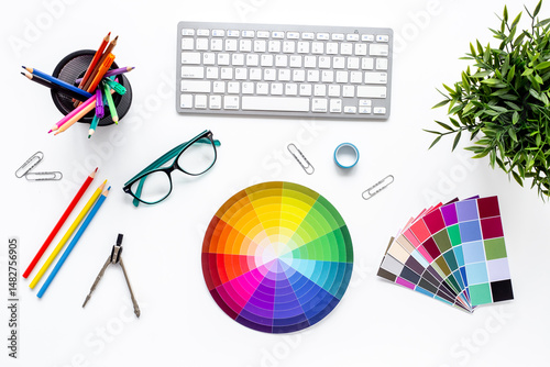 Color paint swatches and decorator or designer tools for work. Desktop flat lay, top view