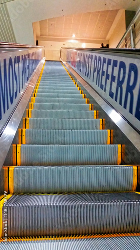 Escalator going up at an international airport