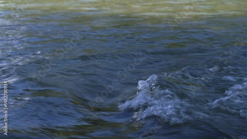 Wallpaper Mural Tight shot of blue-green river water rippling and swirling in natural light. Captured in Tzoumerka. Torontodigital.ca