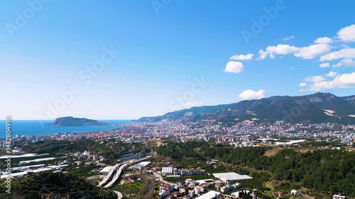 Aerial Drone Pan of Alanya City with Castle, Sea, and Taurus Mountains