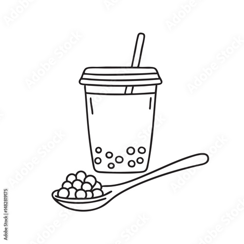 A tapioca ball resting on a spoon beside a bubble tea cup