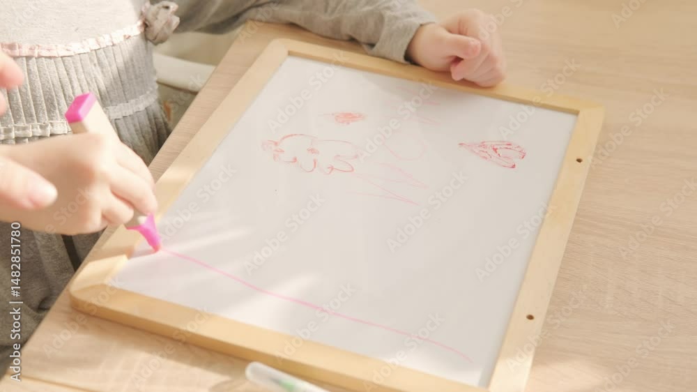Preschool child draws letters, hearts, develops handwriting, fine motor skills, learning, early education, kindergarten games, earlier child development Preschool child draws letters, hearts, develops handwriting, fine motor skills, learning, early education, kindergarten games, earlier child development
