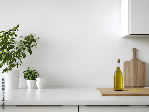 Minimalist kitchen countertop with sleek bottle of cooking oil  wooden cutting board  and green potted plants creating fresh and clean atmosphere