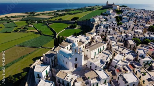 The white town of Ostuni's skyline and church are located in Brindisi, Apulia, Italy