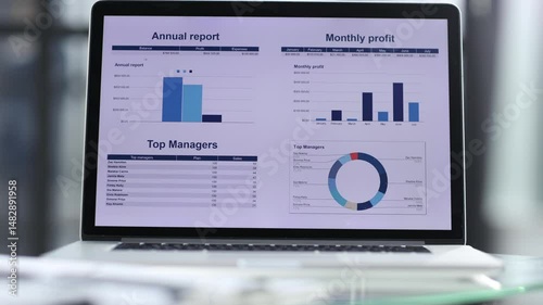 Businessmen discuss a business plan in the office with a laptop