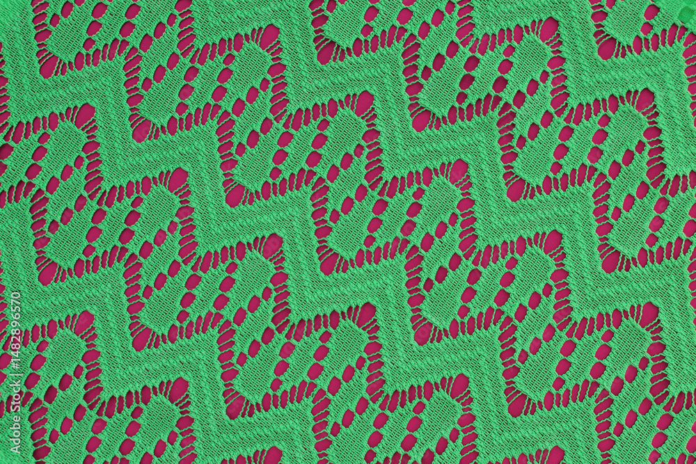 Fototapeta premium green fabric with geometric lace pattern. abstract geometric background