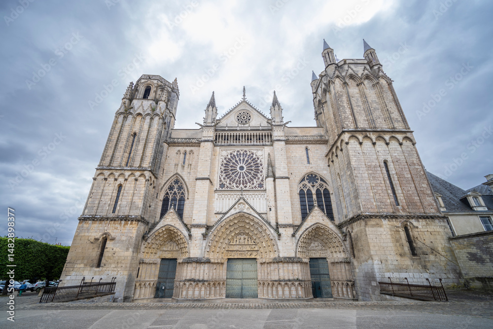Fototapeta premium Poitiers Cathedral imposing facade rising under cloudy sky in France