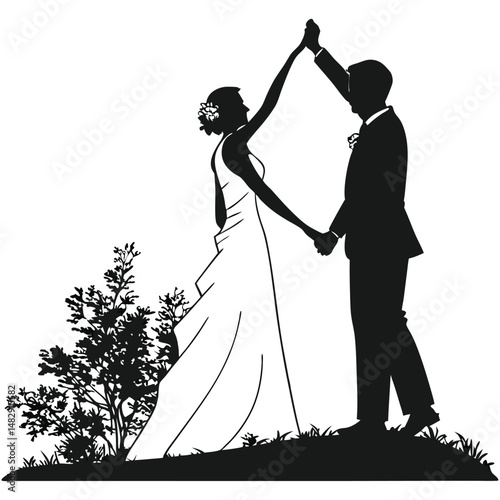 Silhouette of a newlywed couple dancing on their wedding day in a field setting