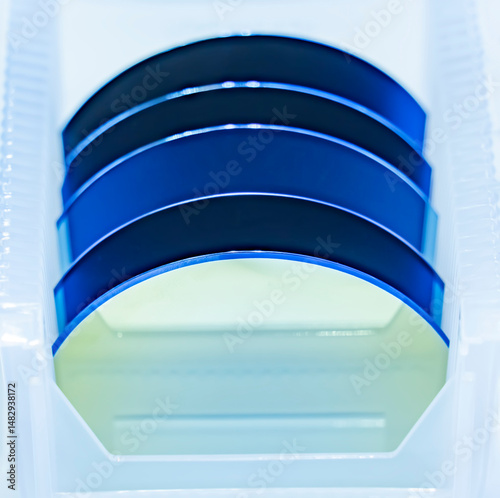 patterned silicon wafers in a universal pod. Electronic circuit designs have been built onto the wafers using micromaching including photolithography