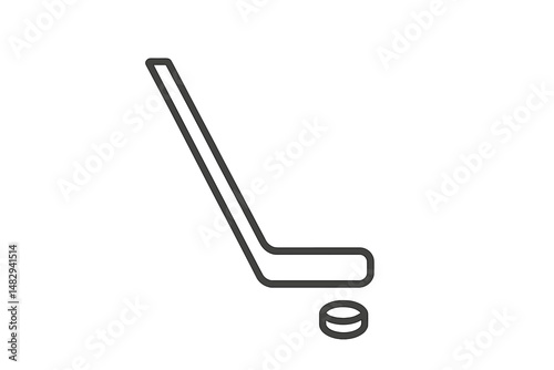 Hockey stick in action with puck positioned for a perfect shot in an indoor rink setting