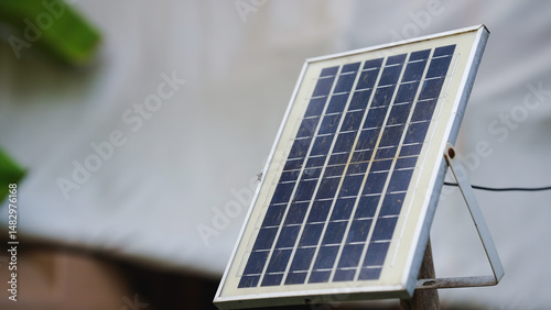 Solar panel on a stand, showcasing renewable energy technology outdoors.