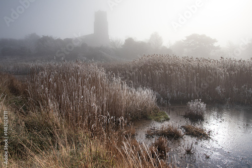 Church through misty morning on the marsh