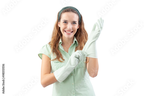 Smiling woman wearing rubber gloves for house cleaning and looking at the camera. Front view, isolated on white background. Concept of hygiene, domestic work, housekeeping, and home cleaning service