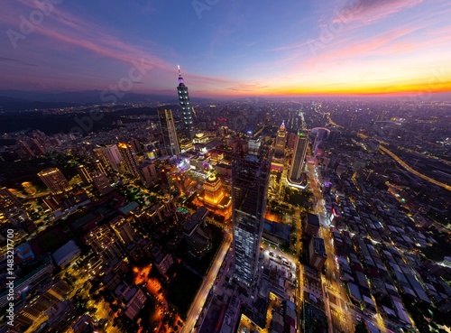 Wallpaper Mural Aerial skyline of Downtown Taipei at nightfall, the vibrant capital city of Taiwan, with 101 Tower standing out among the skyscrapers in Xinyi Financial District and city lights dazzling at blue dusk Torontodigital.ca