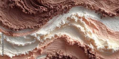 Swirling textures of chocolate, vanilla and strawberry ice cream create a delicious visual delight in a scoop of frozen treat