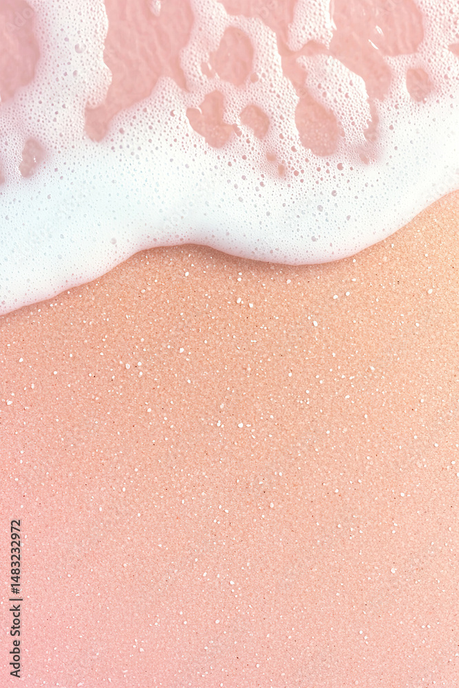 Fototapeta premium Pink sand beach with gentle waves and white foam creating serene and dreamy atmosphere