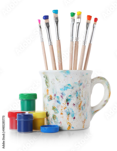 Brushes with color paints isolated on white