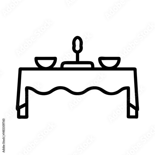 Elegant table setting with bowls and a candle on a tablecloth  