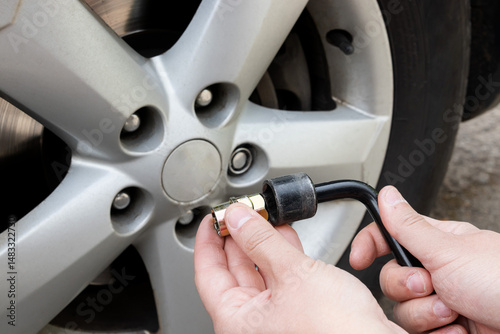 Photography Installing locking lug nut using special key