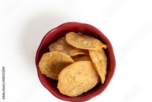 Mathri, or Mathi an Indian a flaky biscuit savoury snack made with all-purpose flour, wheat  flour. Top view.