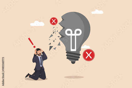 Failed Idea and Business Failure. A Frustrated Businessman Kneeling Before a Shattered.