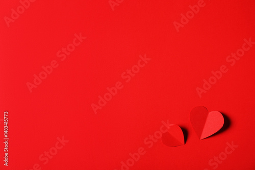 Paper hearts on red background, flat lay. Space for text photo