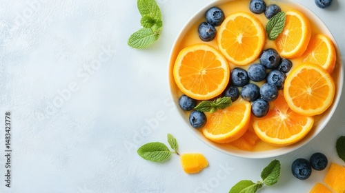 Wallpaper Mural Fresh fruit salad with vibrant oranges and blueberries in a sunny kitchen setting Torontodigital.ca