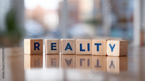Wooden blocks spelling out the word reality arranged on a reflective surface conveying a message about truth and authenticity photo