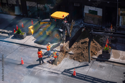 work on laying power underground cable on the street in the city