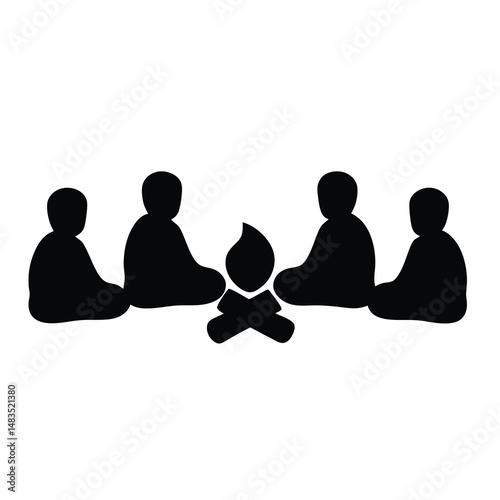 Silhouette of five people sitting around a campfire at night enjoying a gathering
