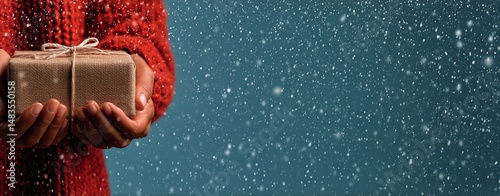 Winter Holiday Gift With Snow Falling in Cozy Indoor Setting During Celebrati...
