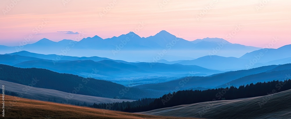 Obraz premium Misty Mountain Range at Dawn
