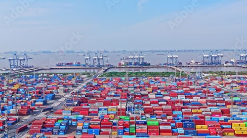 4K Real Time Aerial view of Industrial port with containers in Shanghai Waigaoqiao container Port Area.