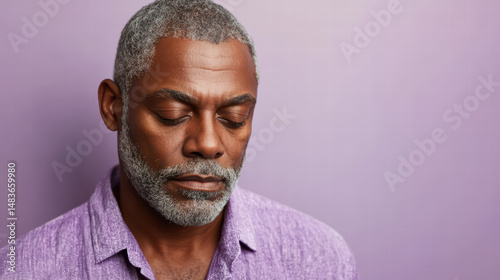 Serene Contemplation: A dignified man with closed eyes is immersed in deep thought, evoking introspection and peaceful contemplation.