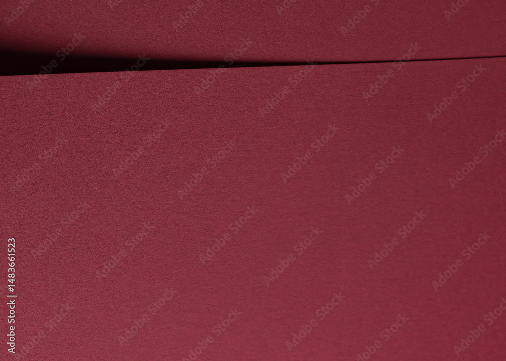Fototapeta premium Dark red and burgundy paper texture with a matte finish. Rich, fancy material featuring a