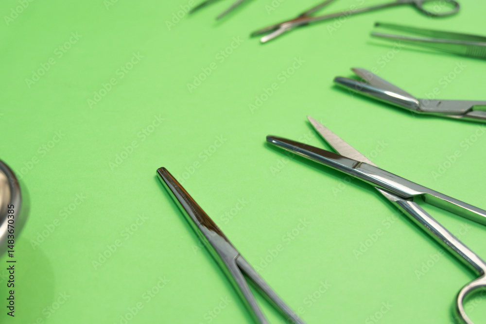 Naklejka premium Set of Surgery Instrument over Green background. Include Scissors and forceps. Medical equipment kit