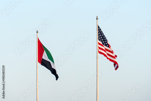 USA and UAE flags are blown in the wind