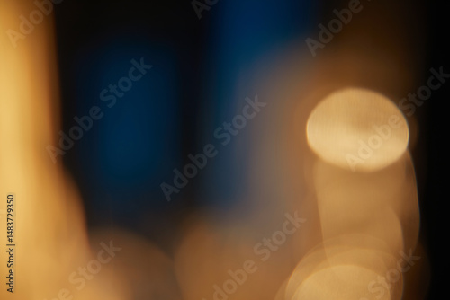 Abstract light leaks on black background with copy space. Studio lens flare bokeh effect.