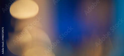 Abstract light leaks on black background with copy space. Studio lens flare bokeh effect.