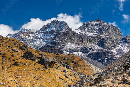 Mera Peak high altitude mountain summit ascent in Himalayas. Stunning views above the clouds at sunrise from the top of the mountain. Alpine route climbing on the snow path in Himalayas