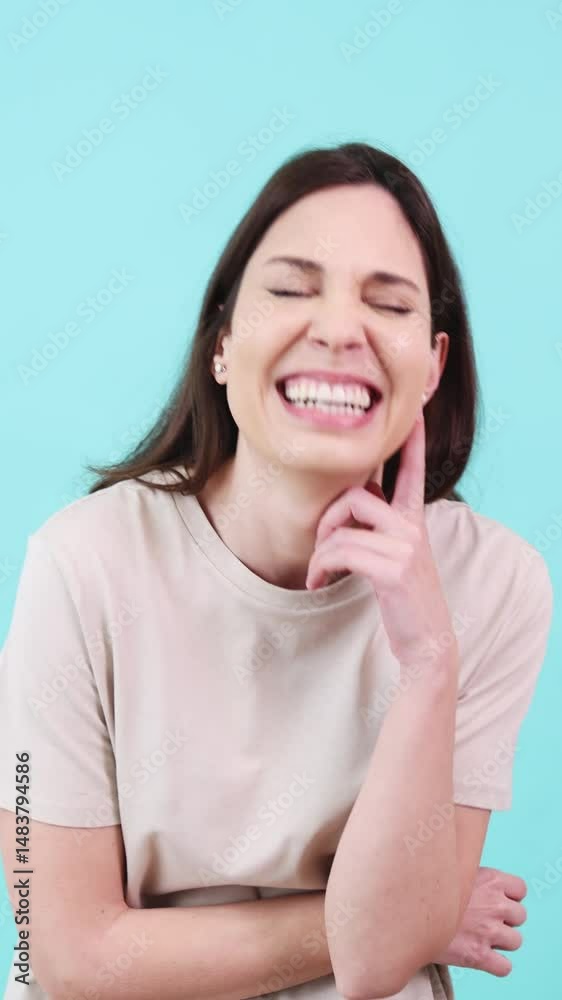 Woman showing different facial expressions on turquoise background Woman showing different facial expressions on turquoise background