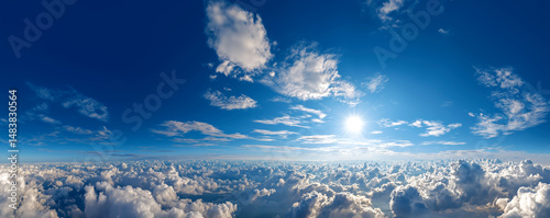 Above the Clouds: A breathtaking panorama captures a sunlit sky, offering a mesmerizing aerial perspective of fluffy clouds, evoking a sense of peace and vastness.