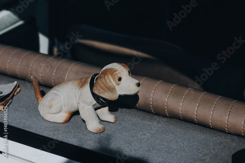 Vintage Bobblehead Dog on Car Parcel Shelf in Retro Interior