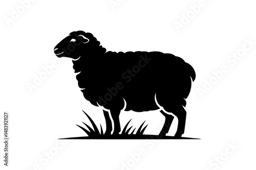 Silhouette of a sheep standing in grass vector art