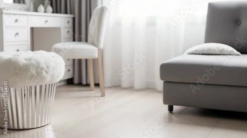 Unique white fluffy ottoman designed to resemble a giant cupcake in a modern apartment interior. A playful novelty furniture piece