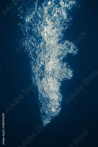 underwater splash bubbles in blue water environment