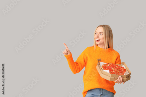 Young woman holding cardboa...