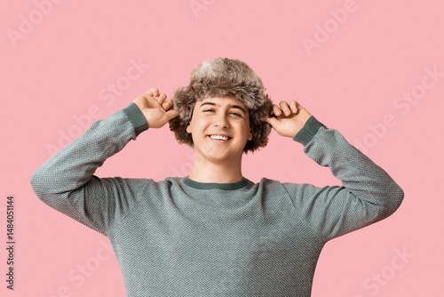 Young man in hat with ear f...